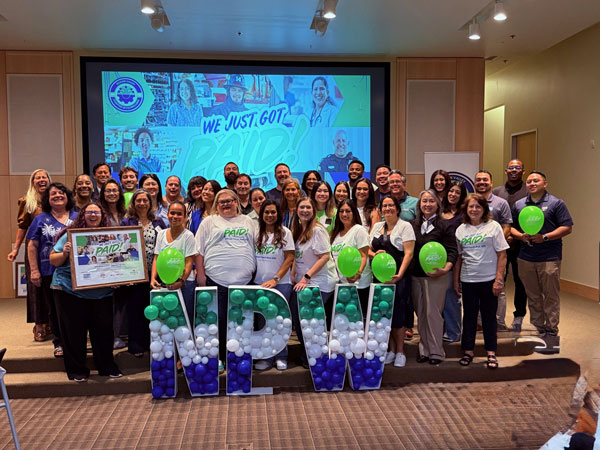 Group of payroll professionals celebrating NPW