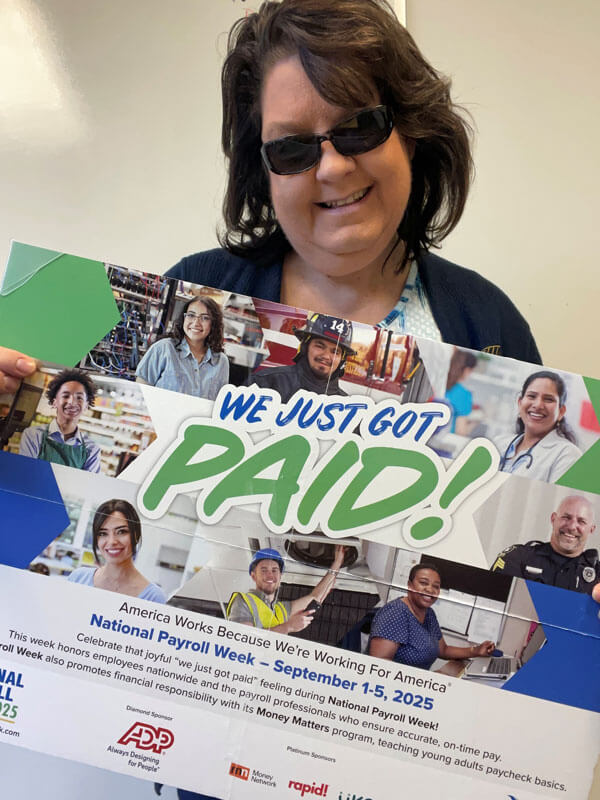 NPW supporter holding NPW sign